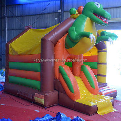 Número OEM Capacidad 100-500kg Dinosaurio Castillo inflable con combinación de diapositivas