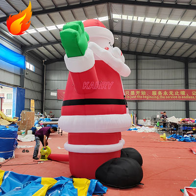 Fiesta de Navidad caliente 4 metros de altura Inflable gigante Santa Claus con características portátiles