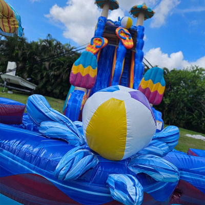 Estimulantes juegos de toboganes de agua de color océano PVC inflable con piscina grande en forma de flor