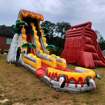 Grandes toboganes inflables para adultos de 36 pies emocionante juego de salto con tema de dinosaurios tropicales