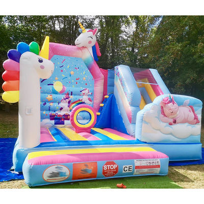Juegos de trampolín para niños de PVC comercial Rainbow Unicorn Inflatable Fun City con tobogán