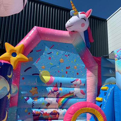 Juegos de trampolín para niños de PVC comercial Rainbow Unicorn Inflatable Fun City con tobogán