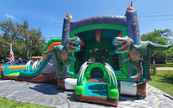 Dinosaurios del Jurásico Comercial PVC Inflable Casa de rebote con deslizamiento con soplador