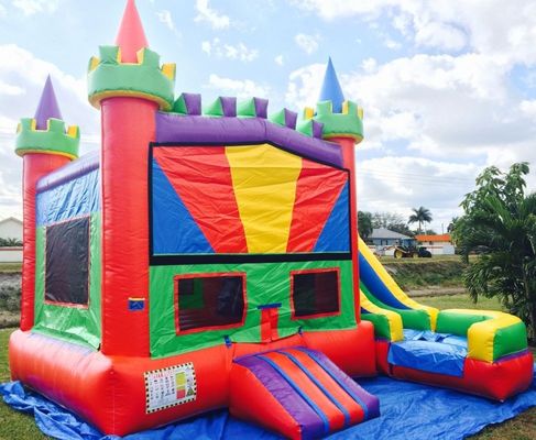Salto de excursión combinado Moonwalk PVC Salto inflable con tobogán de agua